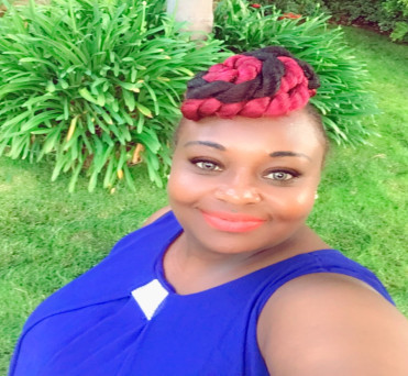 Image of Rebecca W. Theuri Kansas City Missouri at Professional Organization of Women of Excellence Recognized